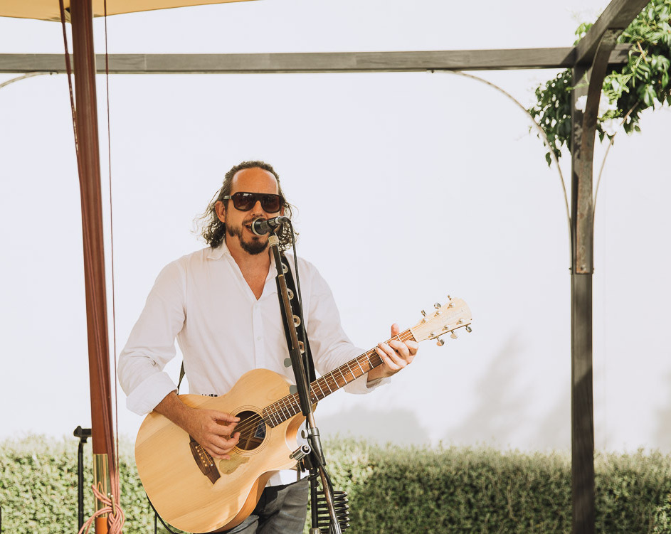 Carl performing during ceremony & canapes at Rebecca and Brett