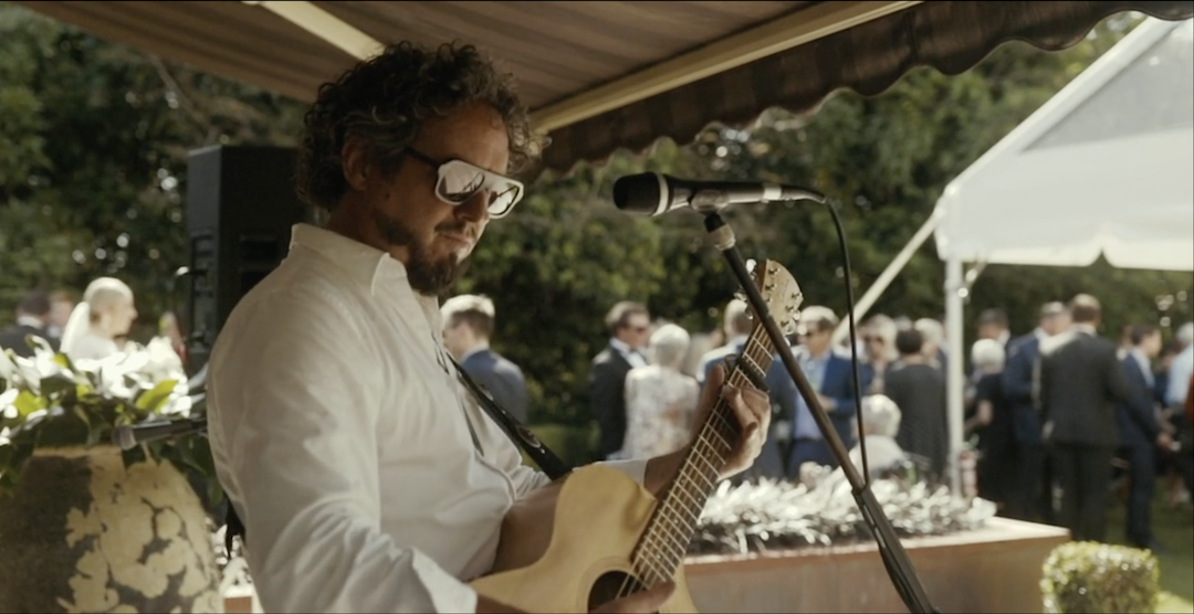 Carl performing during ceremony & canapes at Hannah & Angus